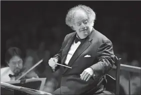  ?? MICHAEL DWYER, FILE/AP PHOTO ?? In this July 7, 2006, file photo, Boston Symphony Orchestra music director James Levine conducts the symphony on its opening night performanc­e at Tanglewood in Lenox, Mass.