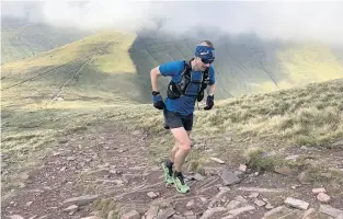  ??  ?? Hall during his record-breaking South Wales Traverse run