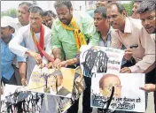  ??  ?? BJP supporters carry out a protest against senior SP leader and former UP minister Azam Khan. PTI FILE