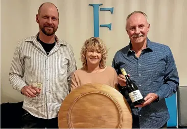  ??  ?? Brightwate­r Vineyards winemaker Tony Southgate, left, with owners Valley and Gary Neale after winning the Colin Harrison Memorial Trophy for the region’s best chardonnay.