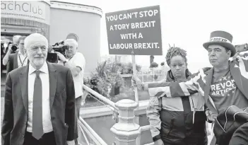  ?? Photo — Reuters ?? Corbyn leaves after an interview with the BBC, during the Labour Party annual conference in Brighton.