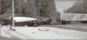  ?? Kevin Myrick / SJ ?? One of two tractor-trailers lies in a ditch following their collision on the U.S. 27 bypass just outside of Cedartown.