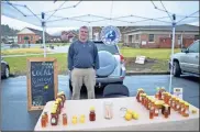  ?? / Sean Williams ?? BeeHaven owner and operator Mike Roshaven brings his honey to the Rockmart Farmers Market on a weekly basis.