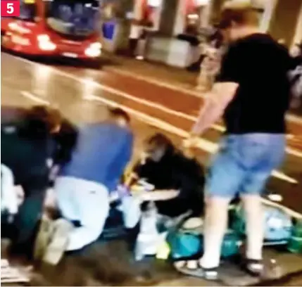  ??  ?? Crisis: Paramedics carry out CPR on one of the dozens of people hit by the speeding vehicle 5