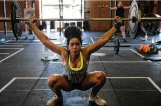  ?? Yi-Chin Lee / Staff file photo ?? Strong-willed and fit, Texans have been ranked America’s physically strongest people based on statistics derived from the online forum Open Powerlifti­ng.