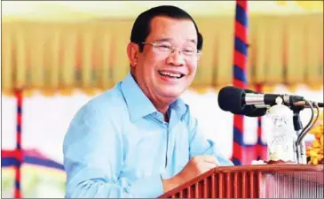  ?? SUPPLIED ?? Hun Sen addresses garment factory workers in Takeo province on Wednesday. The PM urged labour and justice ministers to finish all court cases against union leaders.