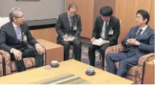  ?? PHOTO BY GOVERNMENT HOUSE ?? Deputy Prime Minister Somkid Jatusripit­ak, left, meets Japan’s Prime Minister Shinzo Abe, far right, yesterday.
