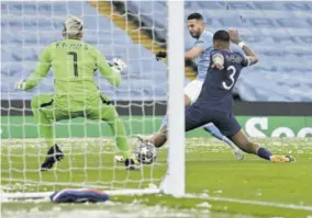  ?? (Photo: afp) ?? Manchester City’s Algerian midfielder Riyad Mahrez (centre) scores the opening goal during the UEFA Champions League second leg semi-final football match between Manchester City and Paris Saintgerma­in at the Etihad Stadium in Manchester, north-west England, yesterday.