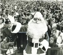  ?? Joe Rosenthal / The Chronicle 1964 ?? The Emporium’s Santa Claus led a parade that for years ended at the store at Fifth and Market streets.