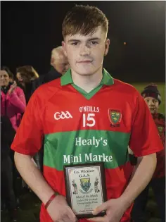  ??  ?? Rathnew’s Eoin Doyle with his Wicklow People sponsored Man of the Match award after the game at Avondale GAA Club.