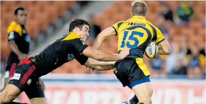  ?? Photo / Stephen Barker, Photosport ?? Richard Kahui tackles Drew Mitchell of the Western Force in 2009. Little did Kahui know that he would be representi­ng the Force more than a decade later.