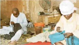  ??  ?? Alhaji Yahaya Ali and Balarabe Sule sewing attires