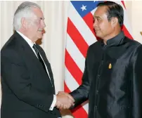  ?? AP ?? Rex Tillerson shakes hands with Prayuth Chan-ocha during a meeting at the Government House in Bangkok on Tuesday. —