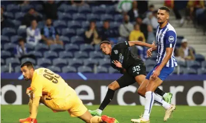  ?? ?? Club Brugge's Antonio Nusa (centre) rounds off a fantastic night for him and his team as they beat FC Porto 4-0 Photograph: Jose Coelho/ EPA