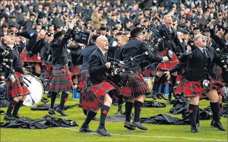  ??  ?? CHAMPIONS: Pipers from the Field Marshal Mongomery band, from Lisburn, Northern Ireland, jump for joy after being named the best in the world.
Picture: Reuters