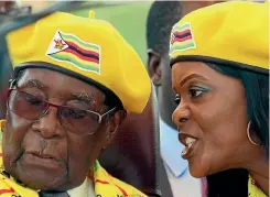  ?? PHOTO: REUTERS ?? Zimbabwe President Robert Mugabe listens to his wife, Grace Mugabe, at a rally of his ruling Zanu-PF party in Harare.