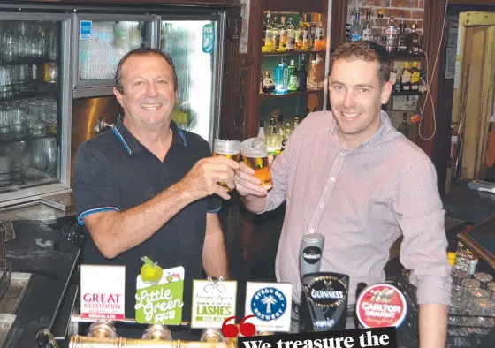  ?? ?? James Pascoe and Steve Flynn toast the plans to upgrade Flynns Irish Bar in Townsville.