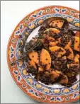  ?? KATIE WORKMAN/The Associated Press ?? Anchovies add depth to this Black Lentil and Butternut Squash dish.