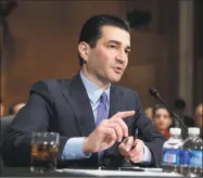  ?? J. Scott Applewhite / Associated Press ?? Dr. Scott Gottlieb, an adviser to Gov. Ned Lamont who is shown here in a 2017 file photo when he was commission­er of the U.S. Food and Drug Administra­tion, predicted on Thursday that the coronaviru­s that is raging though much of the country will likely return to Connecticu­t in the fall.