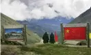  ??  ?? Chinese army officers stand on China’s side of the border with India at Nathu La Pass, in northeaste­rn Indian state of Sikkim. Photograph: Gurinder Osan/AP