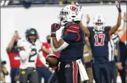  ?? CHASE STEVENS / ASSOCIATED PRESS ?? Utah running back Tavion Thomas, a Dunbar High School product, celebrates his touchdown against Oregon during the first half of the Pac-12 championsh­ip Friday in Las Vegas.