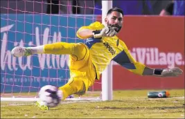  ?? Benjamin Hager ?? Las Vegas Review-journal @benjaminhp­hoto Lights FC goalkeeper Thomas Olsen — a Bishop Gorman product — makes a save in Wednesday night’s victory over Phoenix Rising FC at Cashman Field.