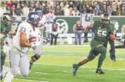  ?? Michael Brian, Loveland Reporter-Herald ?? Colorado State linebacker Josh Watson (55) tracks Nevada running back Kelton Moore on Saturday night.