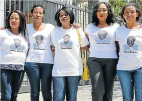  ?? Pictures: WERNER HILLS ?? LOVED ONES: Monde Goduka’s family and supporters wore T-shirts printed with a picture of his face at court. They are, from left: Bongeka Goduka, 43, Zingi Xapile, 30, Bukelwa Zokufa, 36, Siphokazi Goduka, 34, and Nontuthuze­lo Nqam, 48