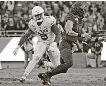  ?? Louis DeLuca / Associated Press ?? No. 9 Texas is 2-6 vs. TCU since 2012. Juwan Mitchell (6) and the Longhorns host Max Duggan and the Horned Frogs today.