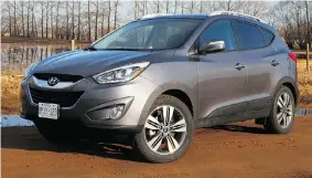  ?? TIM YIP/Driving ?? The 2014 Hyundai Tuscon is handsome, but its performanc­e falls short of remarkable.