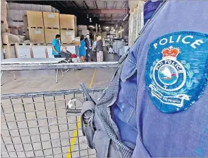  ?? Picture: ELIKI NUKUTABU ?? A policeman guards the printed ballot papers at the Star Printery Ltd
warehouse in Suva on Thursday last week.