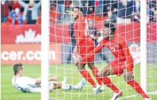  ??  ?? Davies celebrates a goal during a CONCACAF Nations League game against the United States at BMO Field. - AFP photo