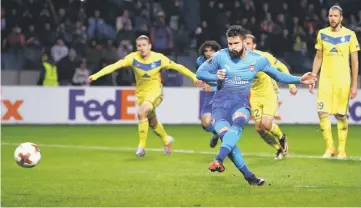  ??  ?? Arsenal’s Olivier Giroud scores the fourth goal from the penalty spot during the UEFA Europa League Group H match against FC BATE Borisov in Borisov, outside Minsk. — Reuters photo