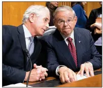  ?? AP/J. SCOTT APPLEWHITE ?? Senate Foreign Relations Committee Chairman Bob Corker (left), R-Tenn., and Sen. Robert Menendez, D-N.J., oversee the vote on President Donald Trump’s nominee for secretary of state, Mike Pompeo, who has faced considerab­le opposition before the panel, Monday on Capitol Hill.