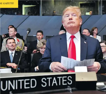  ?? GEERT VANDEN WIJNGAERT / THE ASSOCIATED PRESS ?? U.S. President Donald Trump attends a meeting of the North Atlantic Council during a summit of NATO leaders at the group’s headquarte­rs in Brussels on Wednesday. The day ended with Trump demanding that members such as Canada double their defence spending.