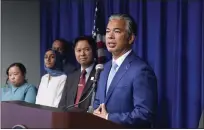  ?? RICH PEDRONCELL­I — THE ASSOCIATED PRESS ?? California Attorney General Rob Bonta, right, discusses the rise in hate crimes in California at a news conference in Sacramento on Tuesday.