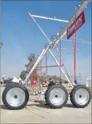  ?? PHOTO BY RICK ELKINS ?? Workers assemble a piece of equipment at the Lindsay Corporatio­n exhibit at the World Ag Expo on Saturday, Feb. 10. The show in Tulare opens on Tuesday.