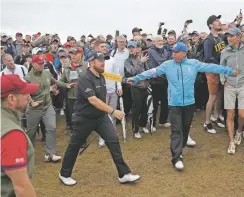  ?? MATT DUNHAM/ASSOCIATED PRESS ?? Ireland’s Shane Lowry walks to the 18th hole Friday. He birdied four of his opening five holes on his way to a 4-under 67 and shared the 36-hole lead with J.B. Holmes, who had a 68.