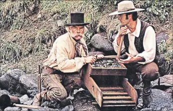  ??  ?? Lee Marvin, left, and Clint Eastwood star in gold rush movie Paint Your Wagon in 1969
