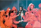  ?? TIMOTHY A. CLARY/GETTY-AFP ?? Kendrick Lamar, performing at the 2018 Grammy Awards, was nominated for eight Grammys on Friday.