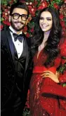  ?? — AFP ?? Actors Ranveer Singh and Deepika Padukone pose for a photograph during their wedding reception in Mumbai on Saturday night.