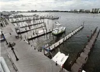  ?? DEVON RAVINE/AP ?? The harbor in Destin, which is home to one of the largest charter fishing boat fleets in the country, is nearly empty.