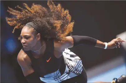  ??  ?? WHIRLWIND . . . American tennis star Serena Williams serves against Belinda Bencic during their Australian Open first round match in Melbourne yesterday.