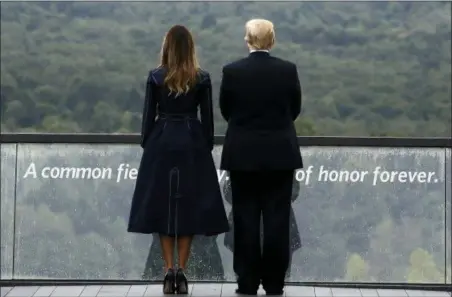  ?? EVAN VUCCI — THE ASSOCIATED PRESS ?? President Donald Trump and first lady Melania Trump, stand along the September 11th Flight 93 Memorial, Tuesday in Shanksvill­e, Pa.,