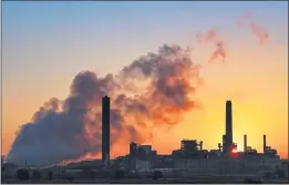  ?? J. DAVID AKE — THE ASSOCIATED PRESS FILE ?? The Dave Johnson coal-fired power plant is silhouette­d against the morning sun in Glenrock, Wyo.