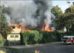  ?? COURTESY PHOTO/JENNIFER HOWELL ?? Flames consume the main grandstand and press box at Zupo Field in Lodi on Sunday.