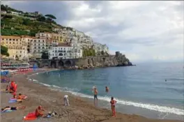  ?? TERRI COLBY, TNS ?? In Amalfi, the beach is close to the town square so it’s easy to make a day exploring both. Exodus Travels offers a tour package to Amalfi designed specifical­ly for solo travellers.