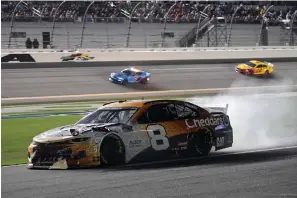  ?? The Associated Press ?? ■ Tyler Reddick (8) heads down pit road after he was in a crash during Saturday’s NASCAR Cup Series race at Daytona Internatio­nal Speedway in Daytona Beach, Fla.