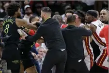  ?? MATTHEW HINTON — THE ASSOCIATED PRESS ?? New Orleans Pelicans forward Naji Marshall (8), left, and Miami Heat forward Jimmy Butler, right, get into a scuffle during the second half of an NBA basketball game in New Orleans, Friday, Feb. 23, 2024. Marshall and Butler were later ejected.