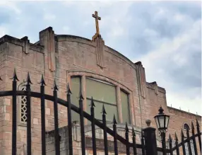  ??  ?? Storm clouds hover over the the Mason Temple of the Church of God in Christ on Tuesday before the Mountainto­p speech Commemorat­ion in Memphis. The church is where Rev. Martin Luther King Jr. delivered his final speech on April 3, 1968, the night before...